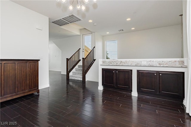 1185 Via Dimartini, Henderson, NV 89052 - empty room with stairs, dark wood-style flooring, a chandelier, baseboards, and recessed lighting