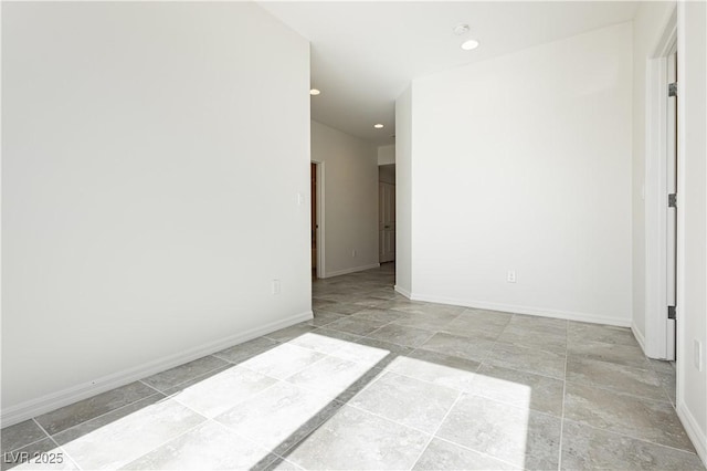 1185 Via Dimartini, Henderson, NV 89052 - empty room with recessed lighting, baseboards, and light stone finish floors