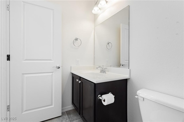1185 Via Dimartini, Henderson, NV 89052 - half bathroom with vanity, toilet, tile patterned floors, and baseboards