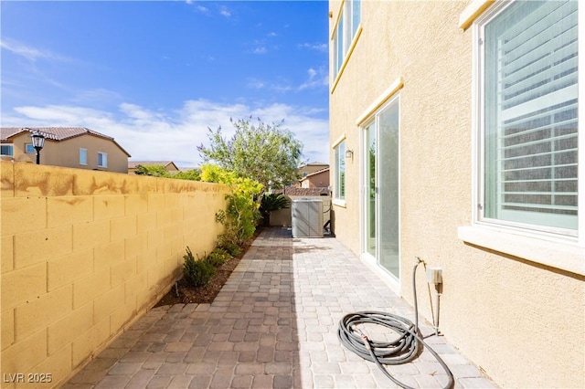 1185 Via Dimartini, Henderson, NV 89052 - fenced backyard with a patio and cooling unit