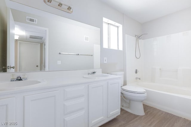 5259 Caspian Springs Dr Unit 203, Las Vegas, NV 89120 - full bathroom with toilet, double vanity,  shower combination, and wood finished floors