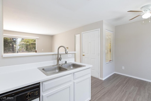 5259 Caspian Springs Dr Unit 203, Las Vegas, NV 89120 - kitchen featuring a sink, dishwasher, a ceiling fan, light wood-style flooring, and light countertops