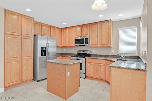 2864 Kinknockie Way, Henderson, NV 89044 - kitchen with stainless steel appliances, light brown cabinets, a sink, light stone countertops, and recessed lighting