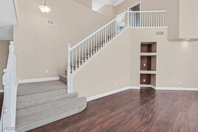 2864 Kinknockie Way, Henderson, NV 89044 - stairway with wood finished floors, baseboards, a high ceiling, and built in features