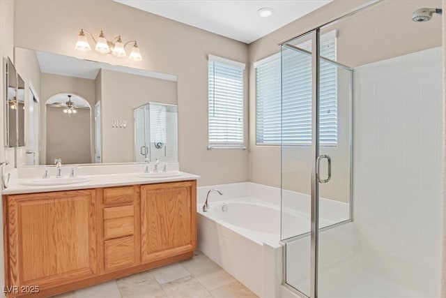2864 Kinknockie Way, Henderson, NV 89044 - bathroom with a shower stall, a bath, double vanity, and tile patterned flooring