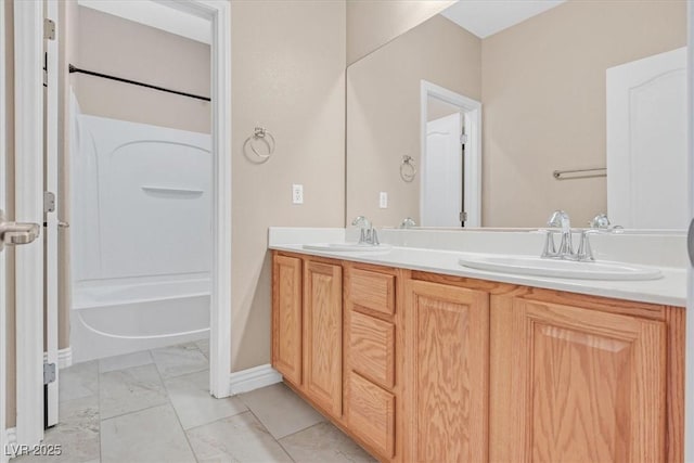 2864 Kinknockie Way, Henderson, NV 89044 - full bathroom with double vanity, marble finish flooring, bathing tub / shower combination, and baseboards