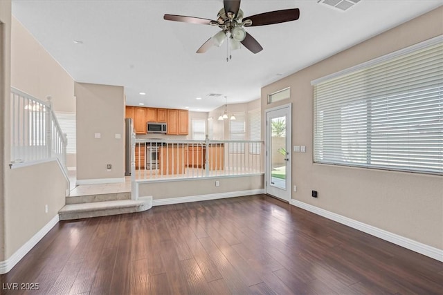 2864 Kinknockie Way, Henderson, NV 89044 - unfurnished living room with a ceiling fan, baseboards, wood-type flooring, a chandelier, and recessed lighting