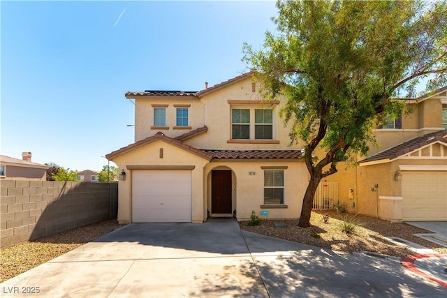 10254 Martinsburg Ct, Las Vegas, NV 89183 - mediterranean / spanish house featuring a tiled roof, stucco siding, concrete driveway, and a garage