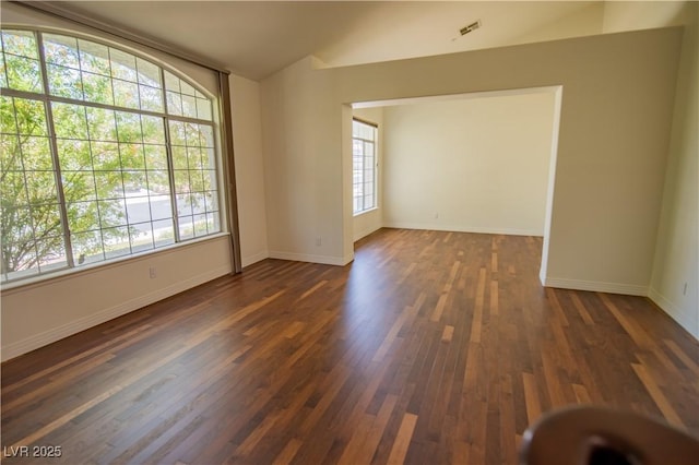 185 Camrose St, Henderson, NV 89074 - empty room with baseboards, dark wood-style flooring, and vaulted ceiling
