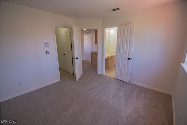 185 Camrose St, Henderson, NV 89074 - unfurnished bedroom with light colored carpet, baseboards, and ensuite bathroom
