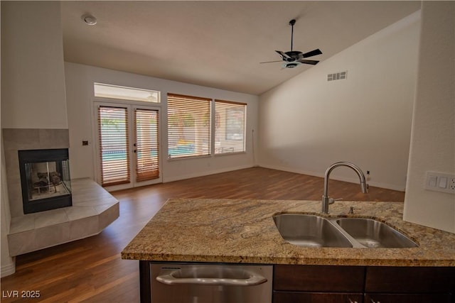 185 Camrose St, Henderson, NV 89074 - kitchen featuring a sink, ceiling fan, dark wood finished floors, lofted ceiling, and a fireplace