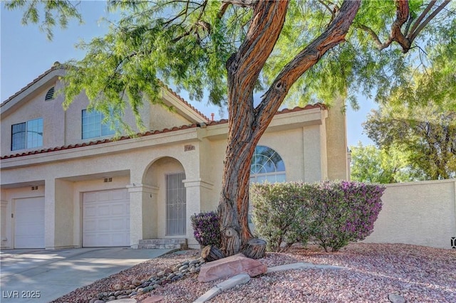 7968 Lisa Dawn Ave, Las Vegas, NV 89147 - view of front of property with a garage, stucco siding, driveway, and a tiled roof