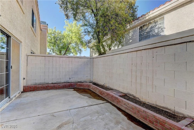 7968 Lisa Dawn Ave, Las Vegas, NV 89147 - fenced backyard with a patio area