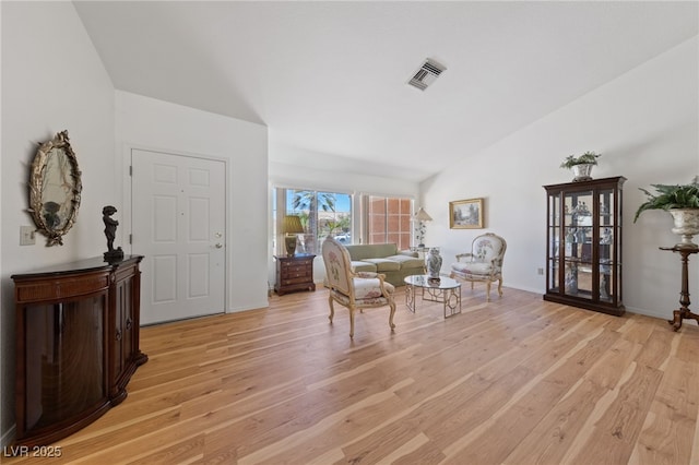 2925 Lotus Hill Dr, Las Vegas, NV 89134 - living area featuring light wood-style flooring and vaulted ceiling