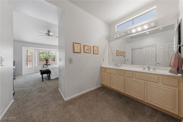 2925 Lotus Hill Dr, Las Vegas, NV 89134 - full bath featuring carpet flooring, double vanity, a ceiling fan, baseboards, and a high ceiling