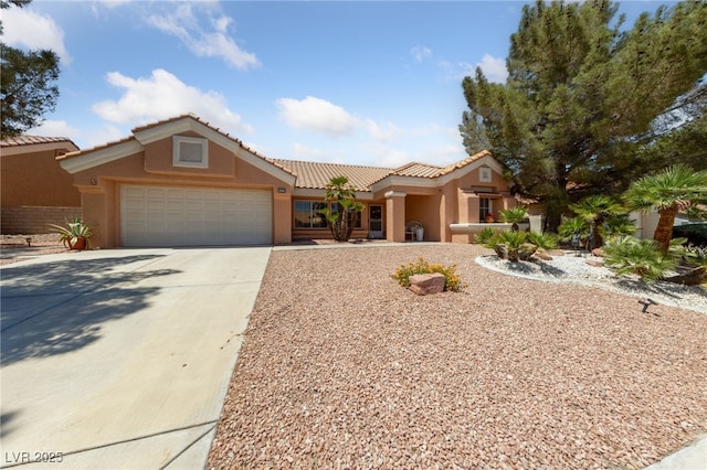 2925 Lotus Hill Dr, Las Vegas, NV 89134 - view of front of house with stucco siding, an attached garage, concrete driveway, and a tile roof