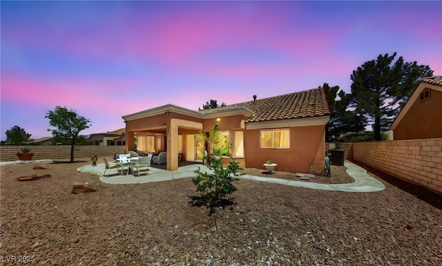 2925 Lotus Hill Dr, Las Vegas, NV 89134 - back of house with a tiled roof, stucco siding, central AC, a patio area, and a fenced backyard