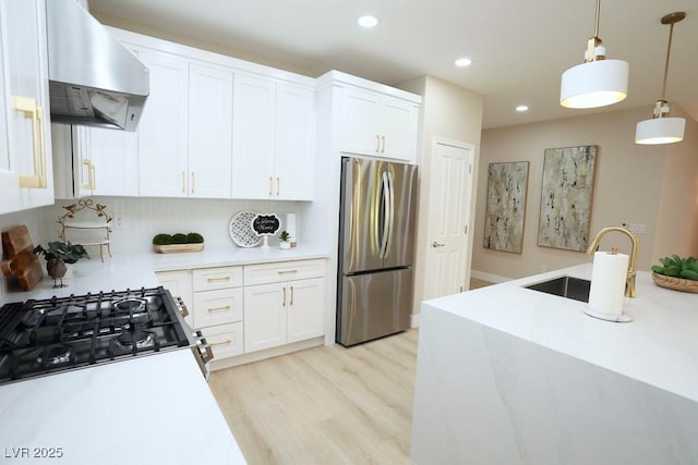 2623 Red Planet St, Henderson, NV 89044 - kitchen featuring freestanding refrigerator, extractor fan, a sink, light countertops, and stove