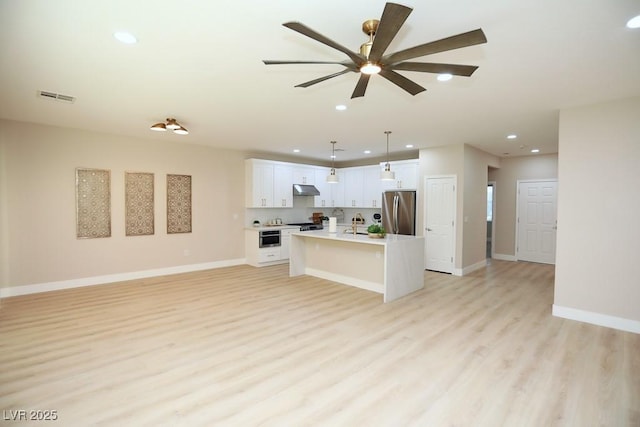 2623 Red Planet St, Henderson, NV 89044 - unfurnished living room featuring light wood finished floors, a ceiling fan, recessed lighting, and baseboards