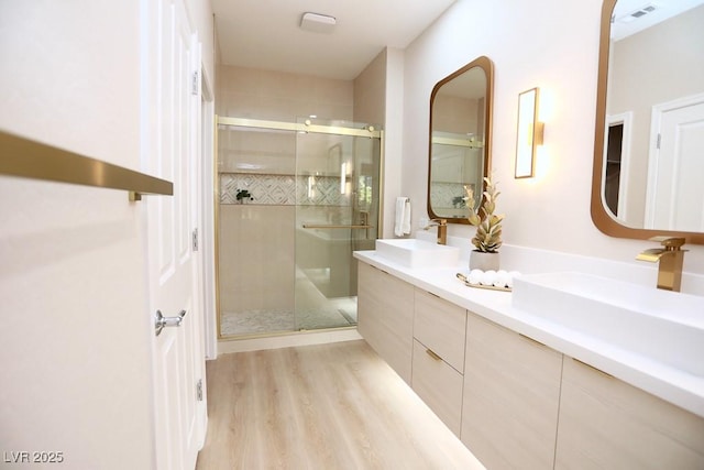 2623 Red Planet St, Henderson, NV 89044 - full bath featuring a shower stall, double vanity, and wood finished floors