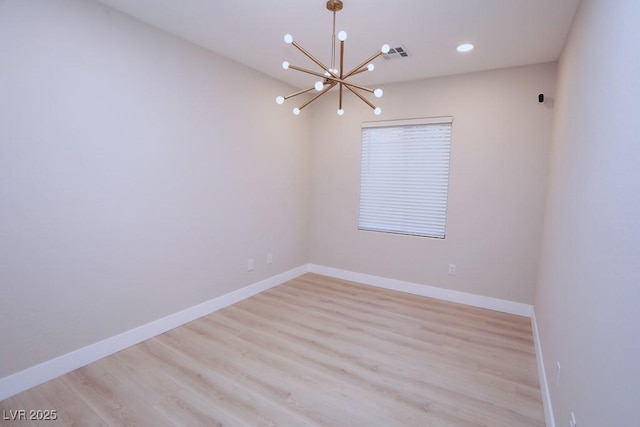 2623 Red Planet St, Henderson, NV 89044 - spare room featuring a chandelier, light wood-type flooring, baseboards, and recessed lighting