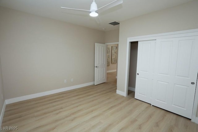 2623 Red Planet St, Henderson, NV 89044 - unfurnished bedroom featuring light wood-style floors, a closet, baseboards, and a ceiling fan