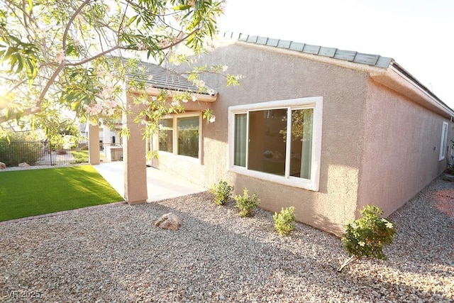 2623 Red Planet St, Henderson, NV 89044 - back of property with stucco siding and a patio area