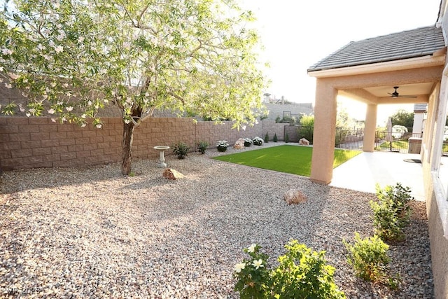2623 Red Planet St, Henderson, NV 89044 - view of yard featuring a ceiling fan and a patio