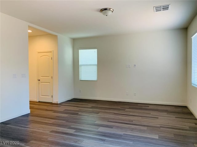 8793 Candelabra Ct, Las Vegas, NV 89148 - empty room featuring wood finished floors, plenty of natural light, baseboards, and recessed lighting