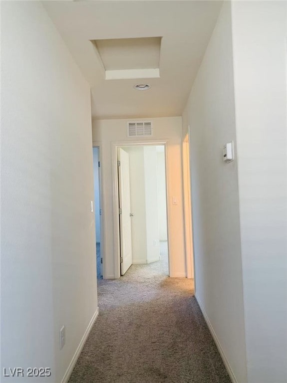 8793 Candelabra Ct, Las Vegas, NV 89148 - hall featuring attic access, carpet flooring, and baseboards