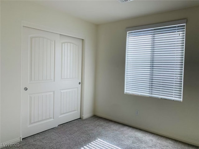 8793 Candelabra Ct, Las Vegas, NV 89148 - unfurnished bedroom with carpet, a closet, and baseboards