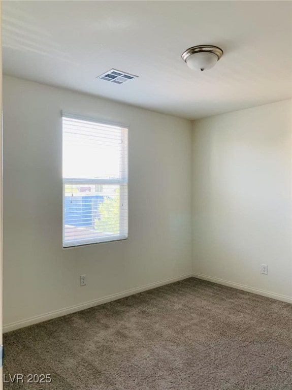8793 Candelabra Ct, Las Vegas, NV 89148 - carpeted spare room with baseboards