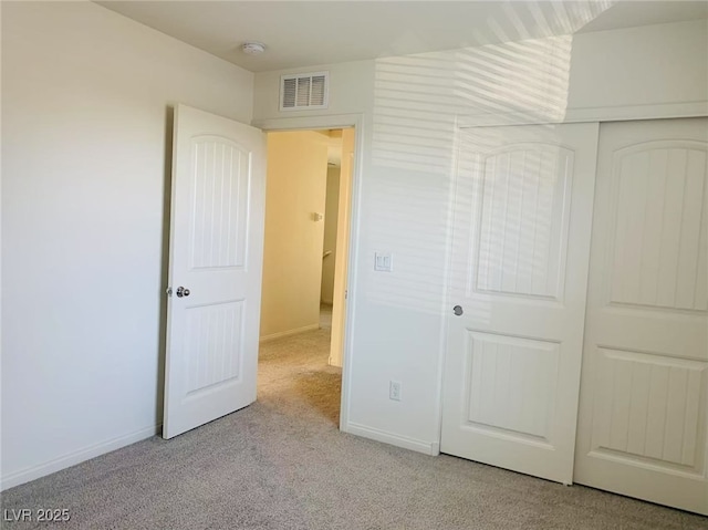 8793 Candelabra Ct, Las Vegas, NV 89148 - unfurnished bedroom featuring light carpet, baseboards, and a closet