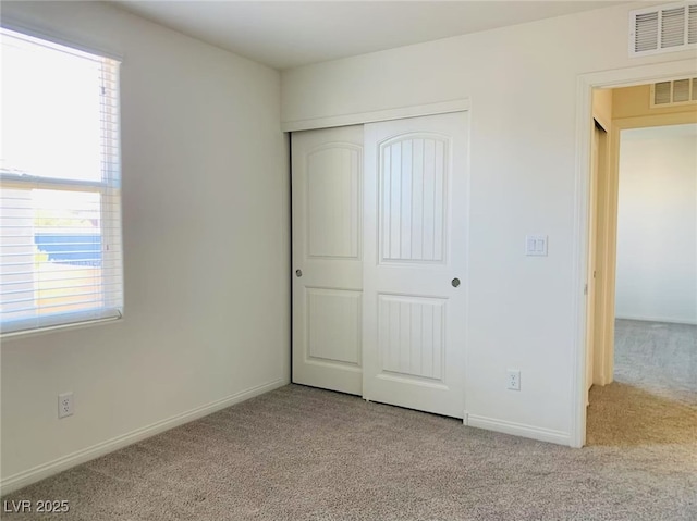 8793 Candelabra Ct, Las Vegas, NV 89148 - unfurnished bedroom with carpet flooring, a closet, and baseboards
