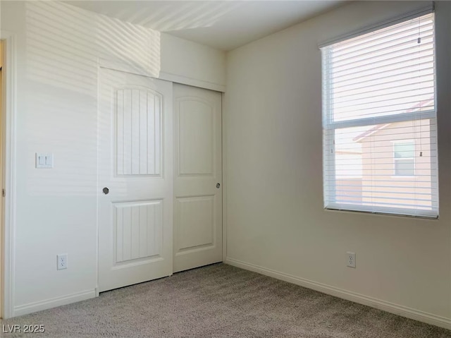 8793 Candelabra Ct, Las Vegas, NV 89148 - unfurnished bedroom featuring carpet floors, a closet, and baseboards