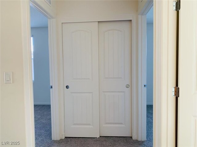 8793 Candelabra Ct, Las Vegas, NV 89148 - hall featuring dark carpet and baseboards