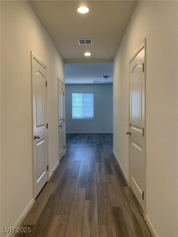 8793 Candelabra Ct, Las Vegas, NV 89148 - corridor with dark wood-type flooring, recessed lighting, and baseboards