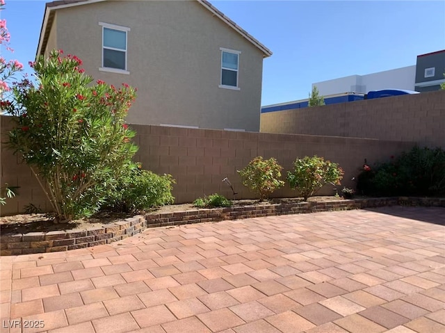8793 Candelabra Ct, Las Vegas, NV 89148 - fenced backyard with a patio