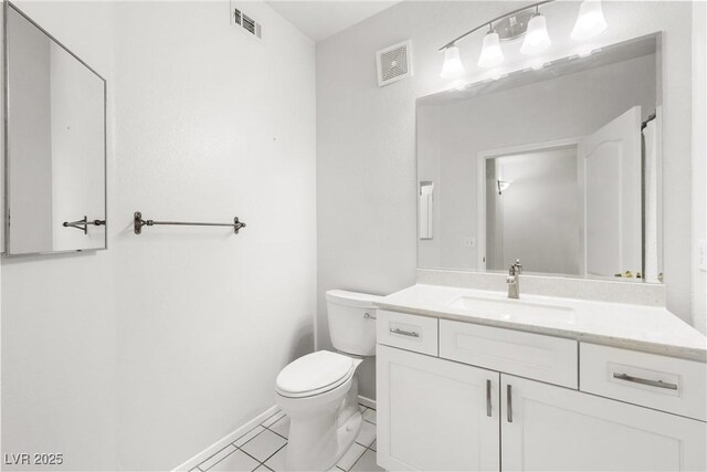 1830 N Buffalo Dr Unit 2014, Las Vegas, NV 89128 - bathroom with toilet, vanity, tile patterned flooring, and baseboards
