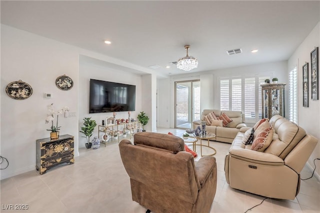 2114 Thelen Ave, North Las Vegas, NV 89086 - living area featuring recessed lighting, light tile patterned floors, a chandelier, and baseboards