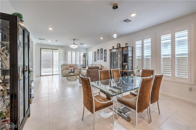 2114 Thelen Ave, North Las Vegas, NV 89086 - dining area with recessed lighting, a chandelier, light tile patterned flooring, and baseboards
