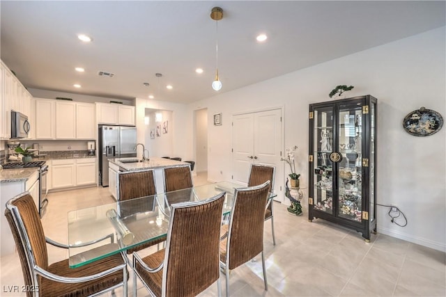 2114 Thelen Ave, North Las Vegas, NV 89086 - dining area featuring recessed lighting, light tile patterned floors, and baseboards