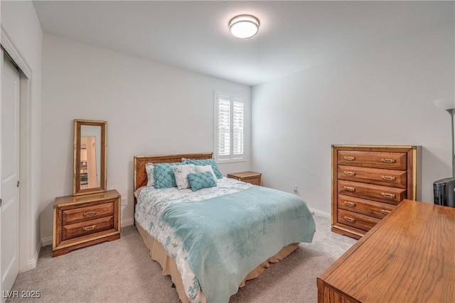 2114 Thelen Ave, North Las Vegas, NV 89086 - bedroom featuring light carpet, a closet, and baseboards