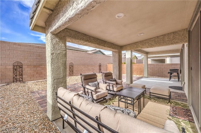 2114 Thelen Ave, North Las Vegas, NV 89086 - fenced backyard featuring outdoor lounge area, a patio area, and a grill