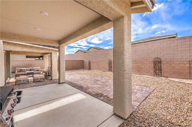 2114 Thelen Ave, North Las Vegas, NV 89086 - fenced backyard with outdoor lounge area, a patio, and grilling area