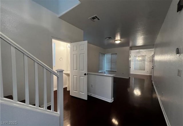 8218 Golden Flowers St, Las Vegas, NV 89139 - hallway with wood finished floors, baseboards, and stairway