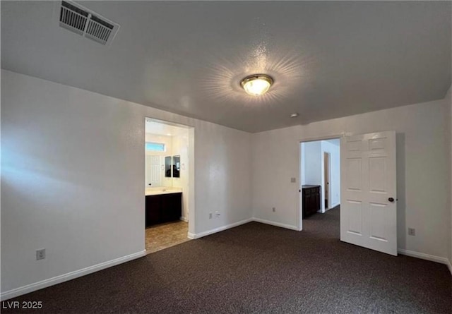 8218 Golden Flowers St, Las Vegas, NV 89139 - empty room featuring baseboards and dark carpet
