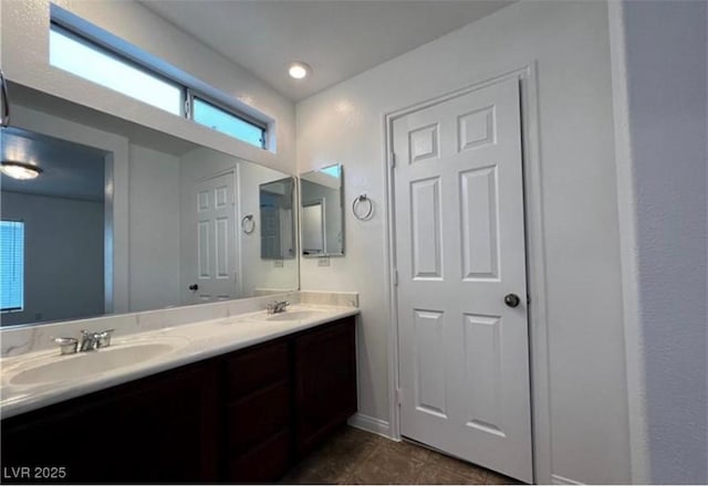 8218 Golden Flowers St, Las Vegas, NV 89139 - full bathroom with double vanity, tile patterned flooring, and baseboards