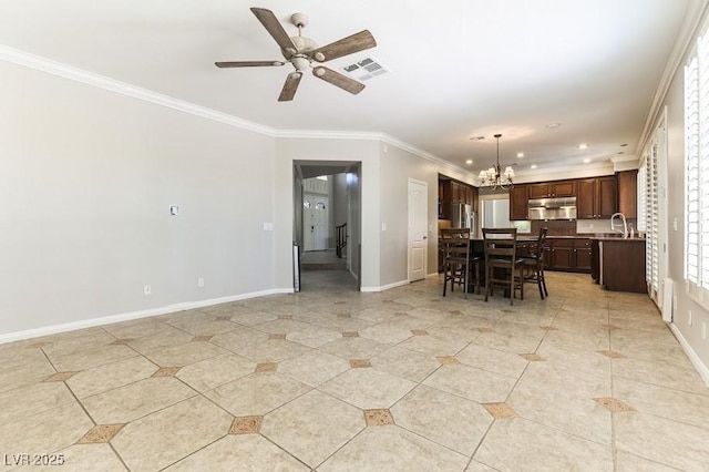 8205 Taos Paseo Ave, Las Vegas, NV 89128 - kitchen featuring under cabinet range hood, a chandelier, a center island, dark brown cabinetry, and ornamental molding
