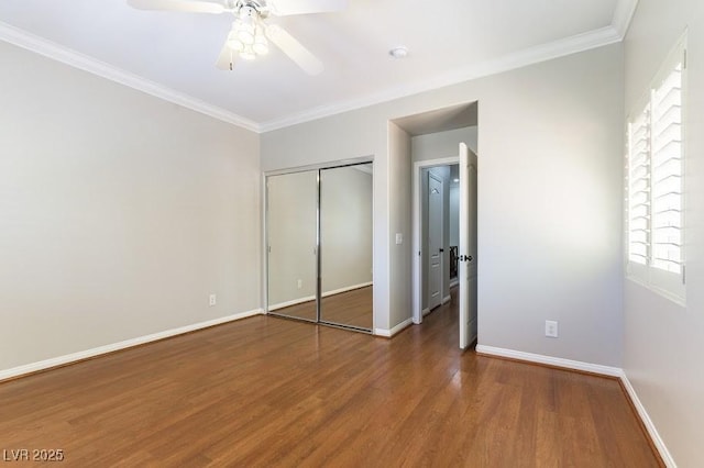 8205 Taos Paseo Ave, Las Vegas, NV 89128 - unfurnished bedroom featuring wood finished floors, baseboards, multiple windows, and ornamental molding